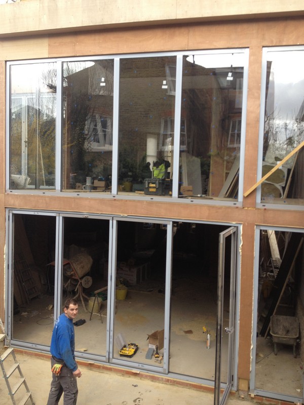 Aluminium bi-fold doors with two-storey glazing in Hornsey