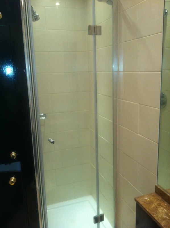 Frameless glass shower enclosure with chrome fittings in Hornsey