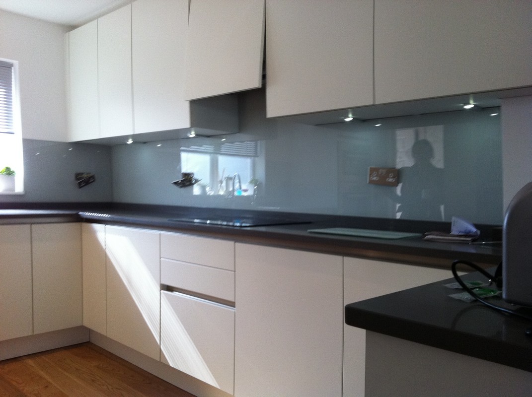 Grey glass kitchen splashback with LED lighting in Hornsey