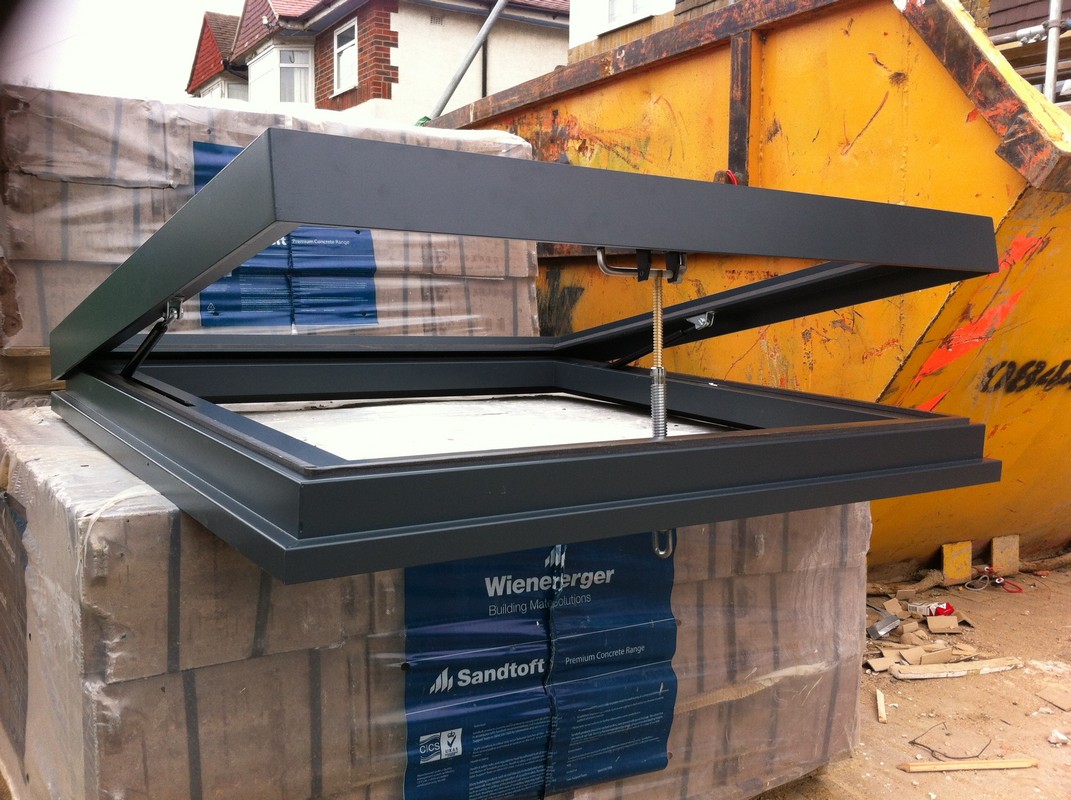 Opening flat roof skylight in anthracite grey installed in Hornsey