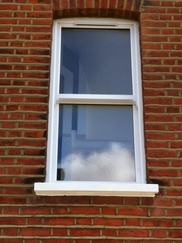 uPVC sash window on Victorian red brick house in Hornsey